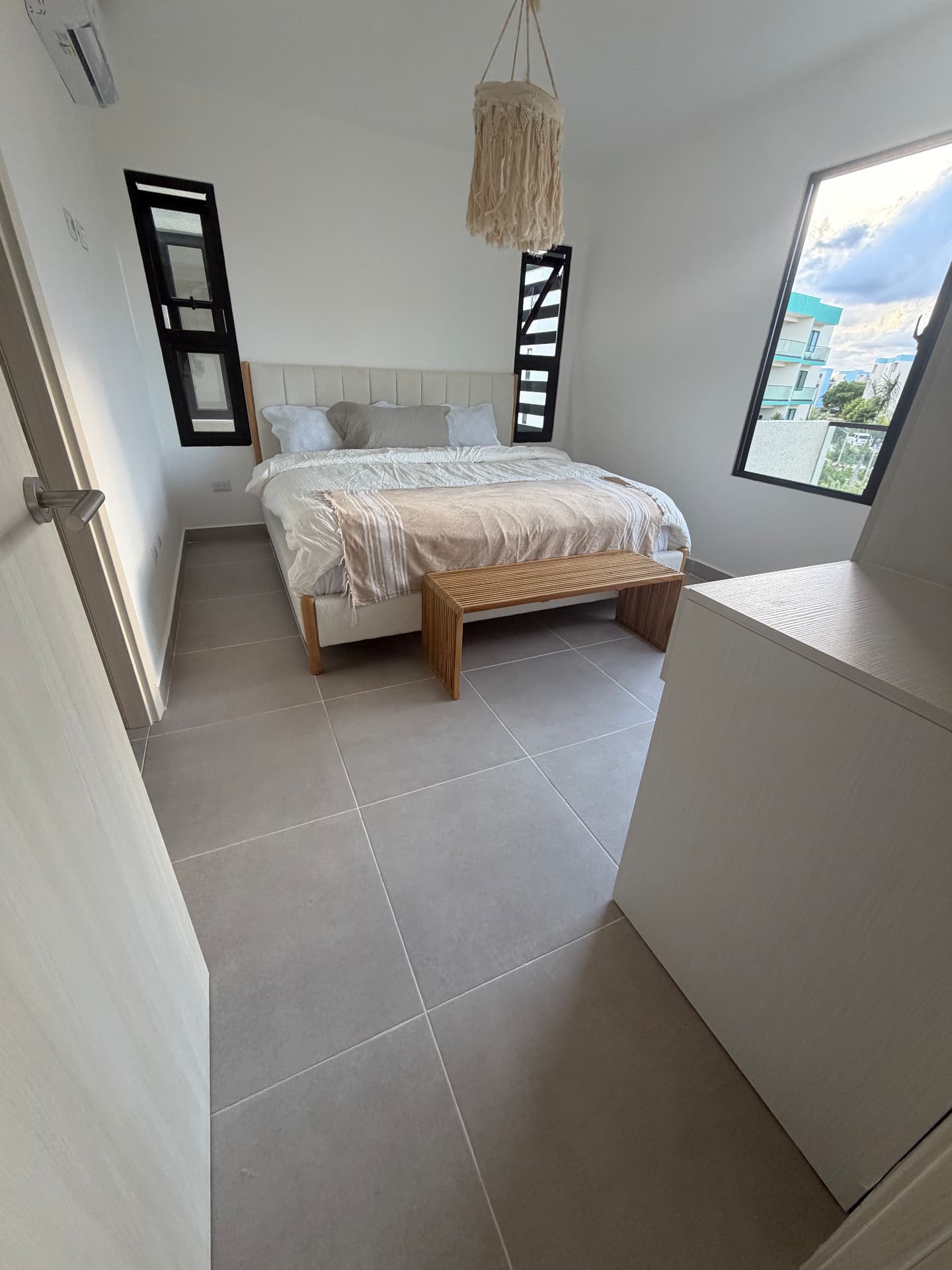 Bright primary bedroom — Serena Village condo, Punta Cana
